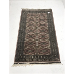 Bokhara beige and pink ground rug, repeating border, geometric patterned field (167cm x 124cm) and a similar rug