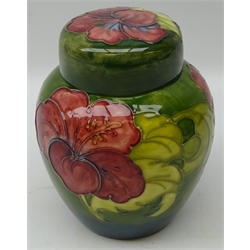  Moorcroft Hibiscus pattern ginger jar and cover on green ground, green signature and original label, H16cm   