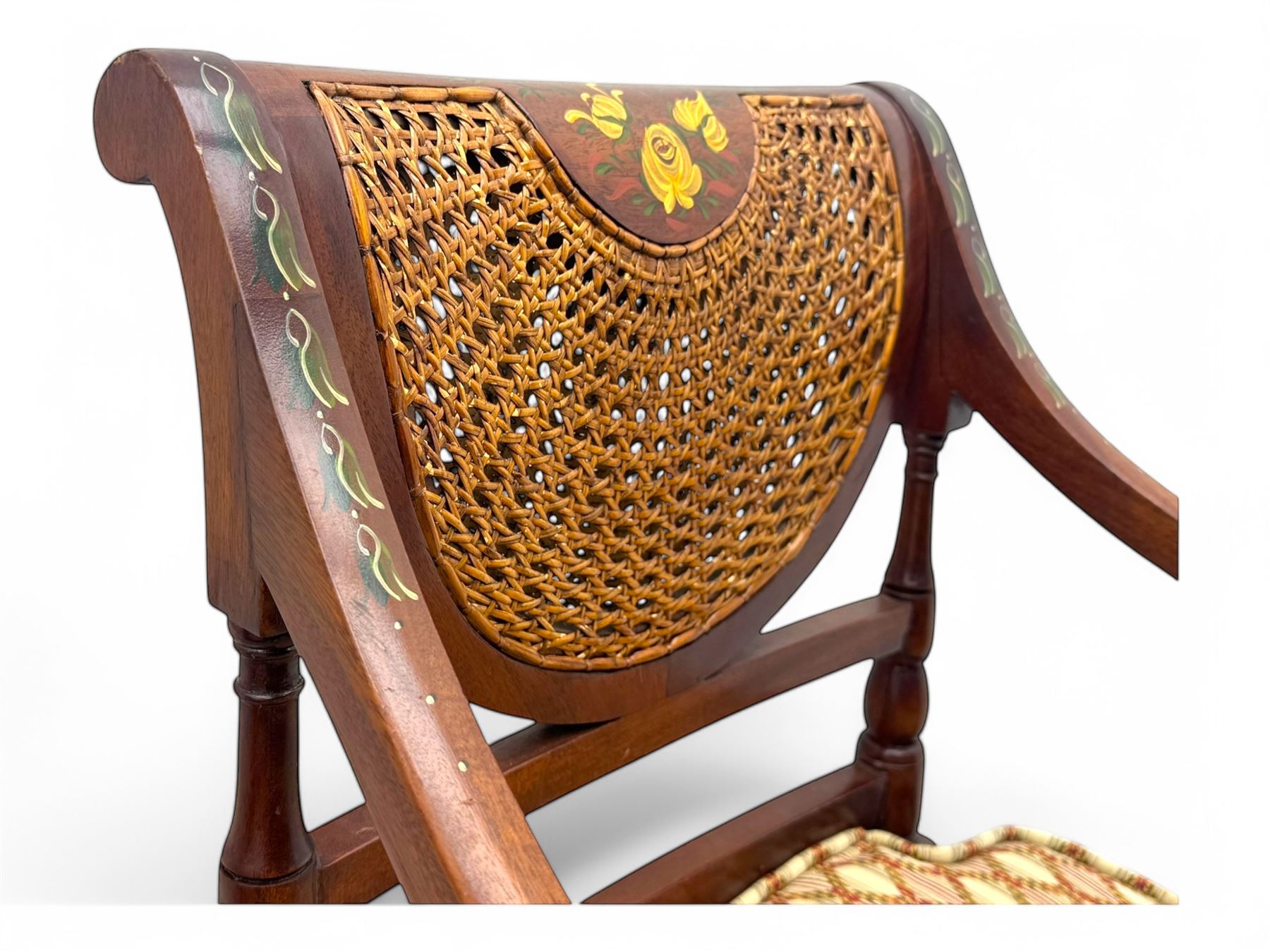 Edwardian Sheraton Revival inlaid mahogany parlour suite, comprising a two-seater settee and two matching armchairs, each with fan-shaped caned back, shaped crest rail with foliate inlay, scrolled open arms, upholstered seat with repeating geometric pattern, on turned and tapered front supports