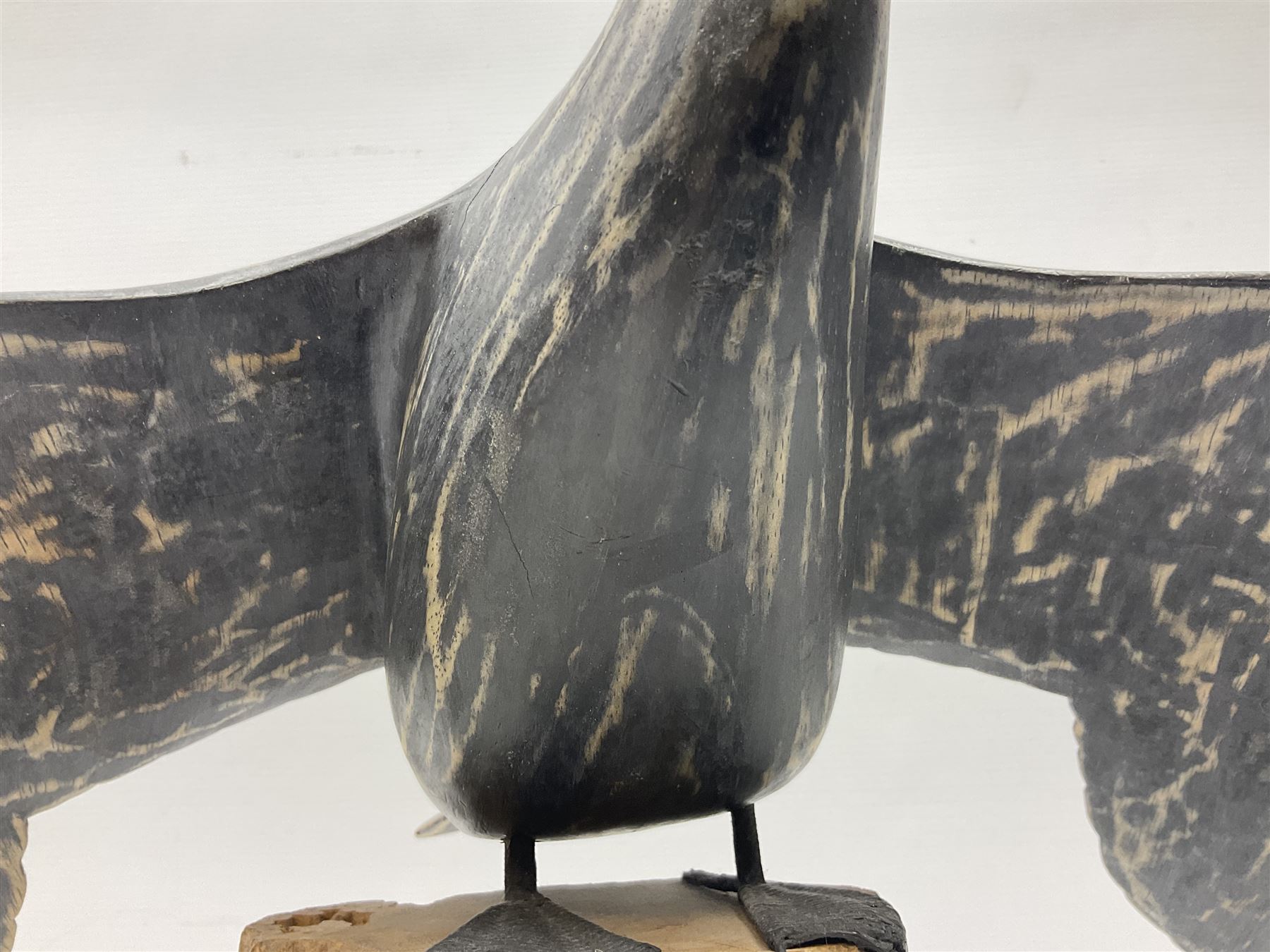 Wooden sculpture of Cormorant aquatic bird on a naturalistic wooden plinth, H46cm