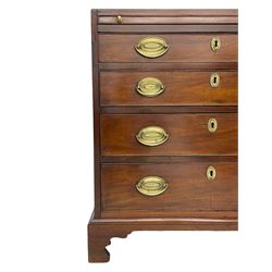 George III mahogany bachelor's chest, brushing slide over four graduating drawers, pressed brass handle plates and escutcheons with acorn and foliate decoration, on bracket feet