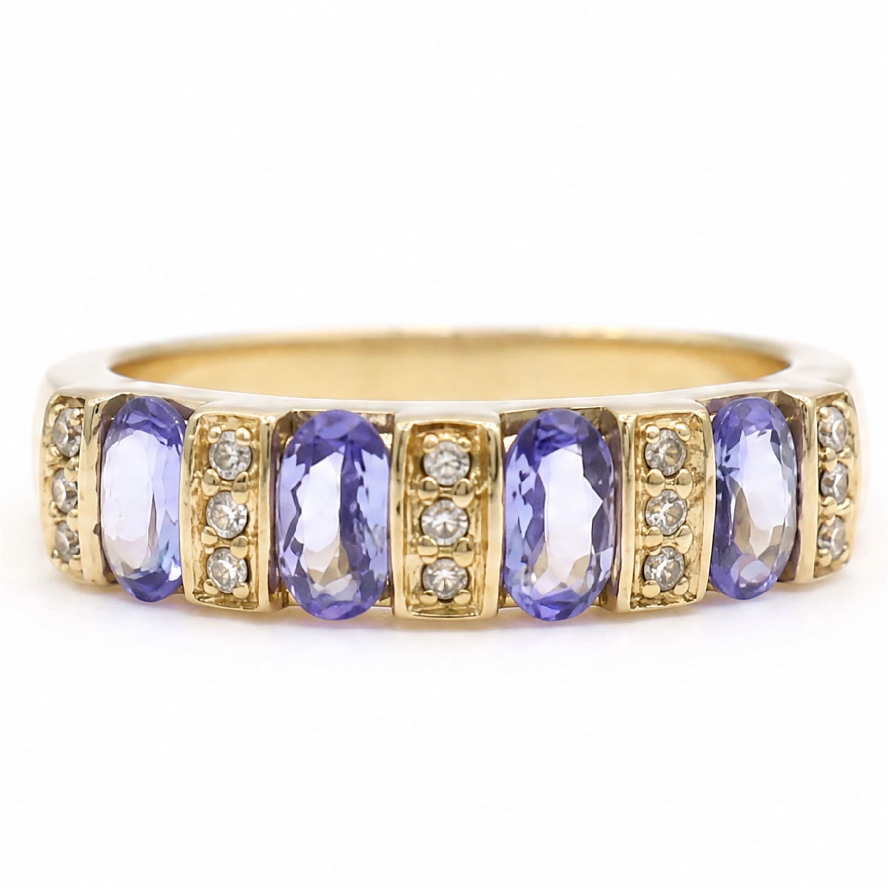 9ct gold tanzanite and diamond half eternity ring, four oval cut tanzanite's, each spaced by three single cut diamonds, hallmarked