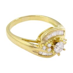 18ct gold diamond crossover ring, the central round brilliant cut diamond of approx 0.45 carat, with round brilliant and tapered baguette cut diamond surround, total diamond weight approx 1.00 carat