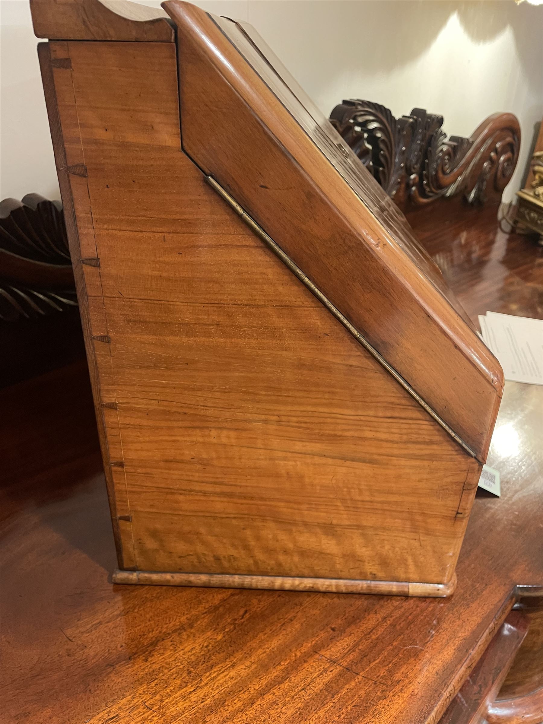 19th century burr walnut correspondence box, the sloped front opening to reveal a fitted interior with perpetual calendar, letter racks, and pen tray between two inkwell recesses, above a pull out draw with recessed brass handle, H41cm L40.5cm D28.5cm