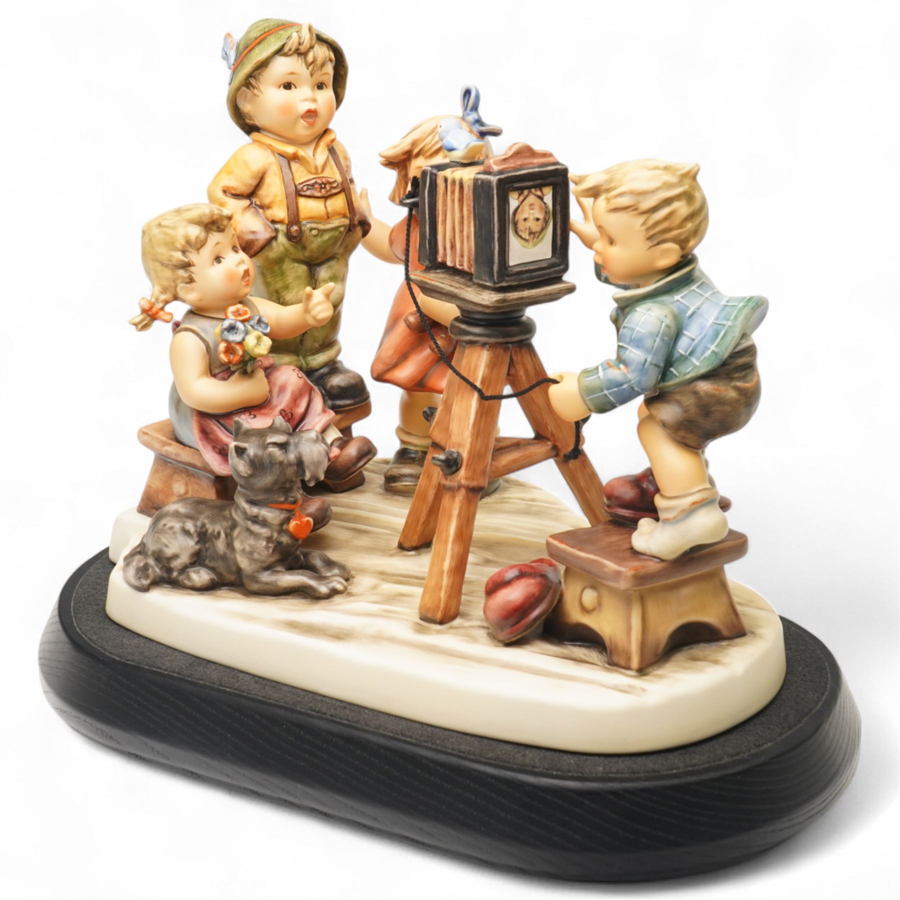 Goebel M I Hummel Club limited edition 25th Anniversary Group figurine 'Picture Perfect', numbered 552/2500, modelled as four children taking a photograph, with stand and plaque, printed marks to base, excluding plinth W27cm 