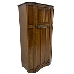 Early to mid 20th century oak hall wardrobe, single door with linenfold panel
