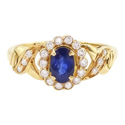 18ct gold sapphire and diamond cluster ring, single oval cut sapphire of approx 0.50 carat...