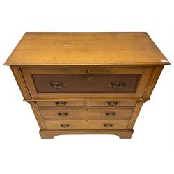 Edwardian oak secretaire or bureau, fall-front enclosing fitted interior over two short and two long drawers, on bracket feet