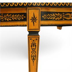 20th-Century Louis XVI-Style satinwood and penwork circular table or pair of console tables, the circular quarter-veneered top decorated in penwork with a central classical mask head motif within scrolling foliate and anthemion ornament on a contrasting black ground, above a conforming frieze decorated with Greek key-type scrolls. Raised on square tapering legs, each with an upper block panel decorated with compass-star motifs.