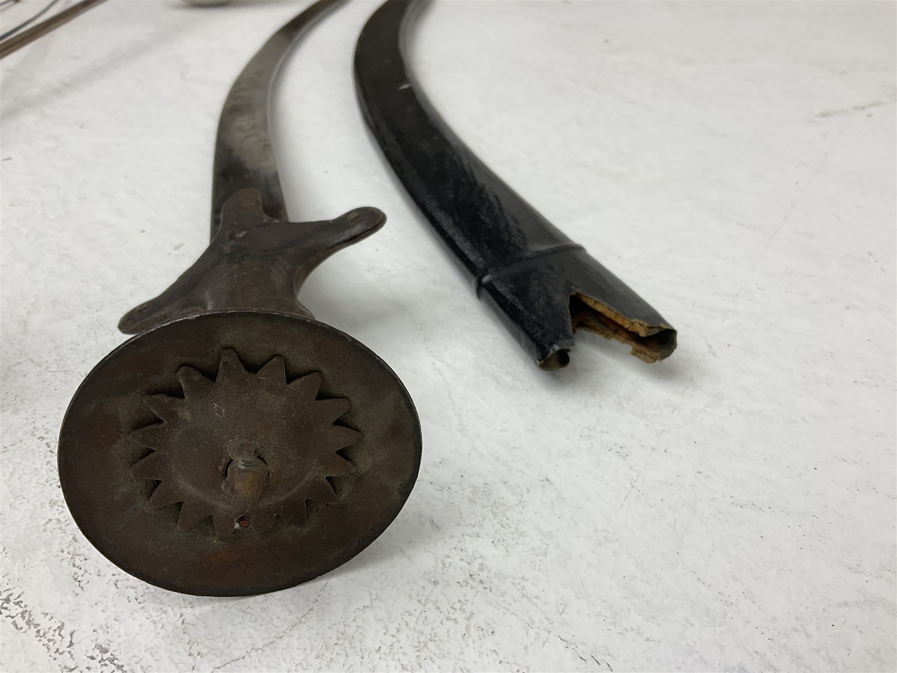 20th century Indian Tulwar sword with 71cm plain curving steel blade and iron hilt with extended langets, knopped grip and spiked pommel; in canvas covered wooden scabbard L87.5cm overall; together with five fencing swords comprising four foils and one epee, three marked Leon Paul, one in carrying case (6)