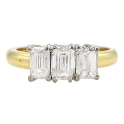 18ct gold three stone emerald cut diamond ring, London assay mark, total diamond weight 1.50 carat