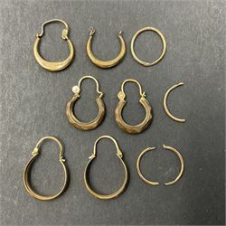 Two pairs of 9ct gold hoop earrings and 9ct gold earring oddments