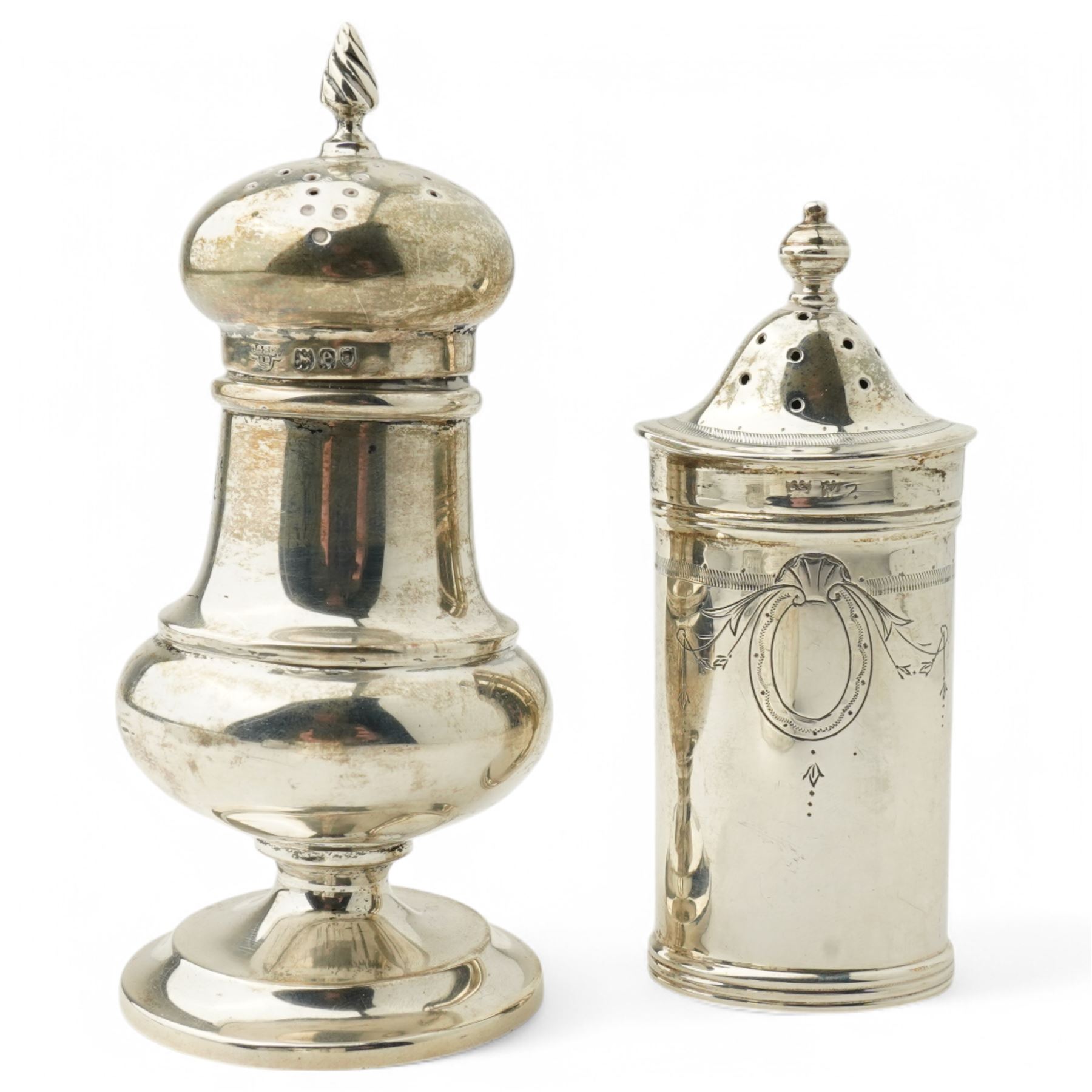 Silver three piece oval condiment set with engraved decoration Birmingham 1961, pierced silver mustard pot Chester 1901, silver pepperette and silver mounted glass salt