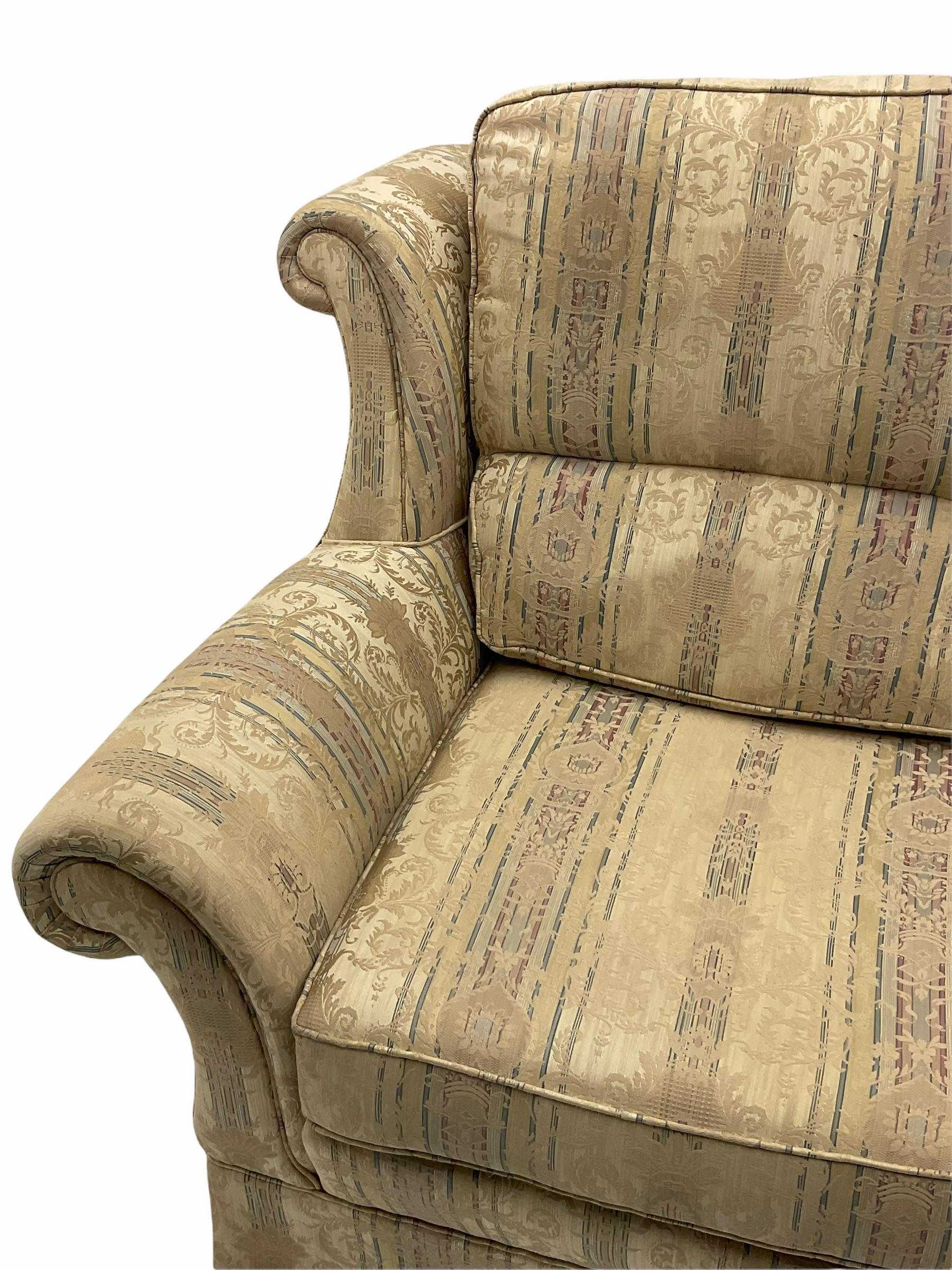 Wade pair traditional shape two seat sofas, upholstered in pale cream