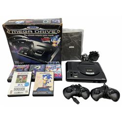 1990s Sega Megadrive 16bit games console with five games comprising Sonic the Hedgehog, Fifa International Soccer, Mickey Mouse Castle of Illusion, MicroMachines 2 Turbo Tournament and 1994 Lillehammer Winter Olympics, boxed with instructions