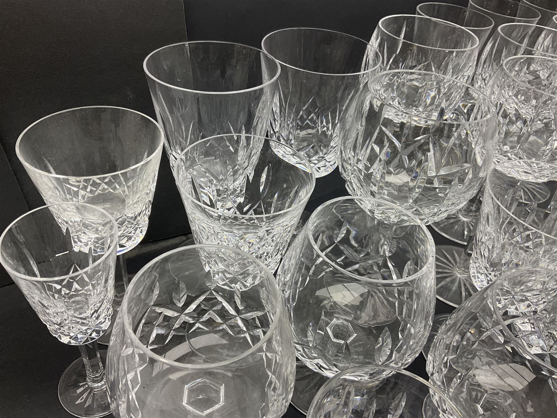 Set of Waterford Crystal Lismore pattern drinking glasses for six people, including hock glasses, goblets, champagne flutes,  sherry glasses, liqueur glasses, hi ball glasses, whisky glasses, brandy balloons, etc, all with etched maker's mark beneath  (62)