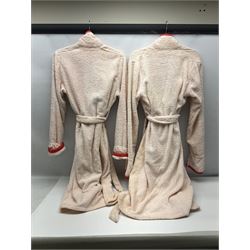 On the direct instructions of Anita Porter nee Lonsbrough Great British Olympic and Commonwealth Games gold medal winning swimmer - collection of early and international memorabilia comprising original Huddersfield Bath Club track suit top bearing eight stitched on cloth badges including British Empire & Commonwealth Games 1958 England Team, YSASA, North Eastern Counties ASA, ESSA Division 3,  English Schools Swimming Association winner etc
The swimming costume Anita wore at the 1958 Commonwealth Games in Cardiff, her first major championships, where she won two gold medals. The grey elastic on the sides, in those days, she would use to make it tighter and more streamlined.
Blue track suit from the 1960 Olympics which she wore on the podium receiving the gold medal.
1960 pool side towelling robe used at the Rome Olympics (interesting to note her name is spelt wrong on the embroidered label).
1962 Commonwealth Games pool side towelling robe used in Perth Australia when winning three Gold medals. 
It was also this year she became BBC Sports Personality of the year, the first female to do so.
Her 'lucky' pool side towel which she took with her to every event she competed in and which can be seen round her neck in many official celebratory photographs. Copies of some of these photographs are included for identification.
In addition there are two souvenir programmes of an evening event to honour Anita at The Theatre Royal Huddersfield and she has kindly signed the front cover on one of these.