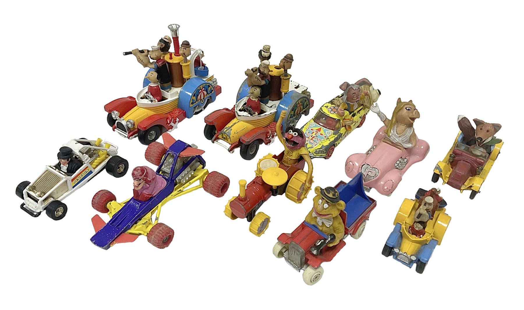 Corgi - ten unboxed and playworn TV/Film related die-cast models including three Popeye Paddle Wagons; Dick Dastardly; Magic Roundabout; Muppets; Batman Penguinmobile; and Basil Brush (10)