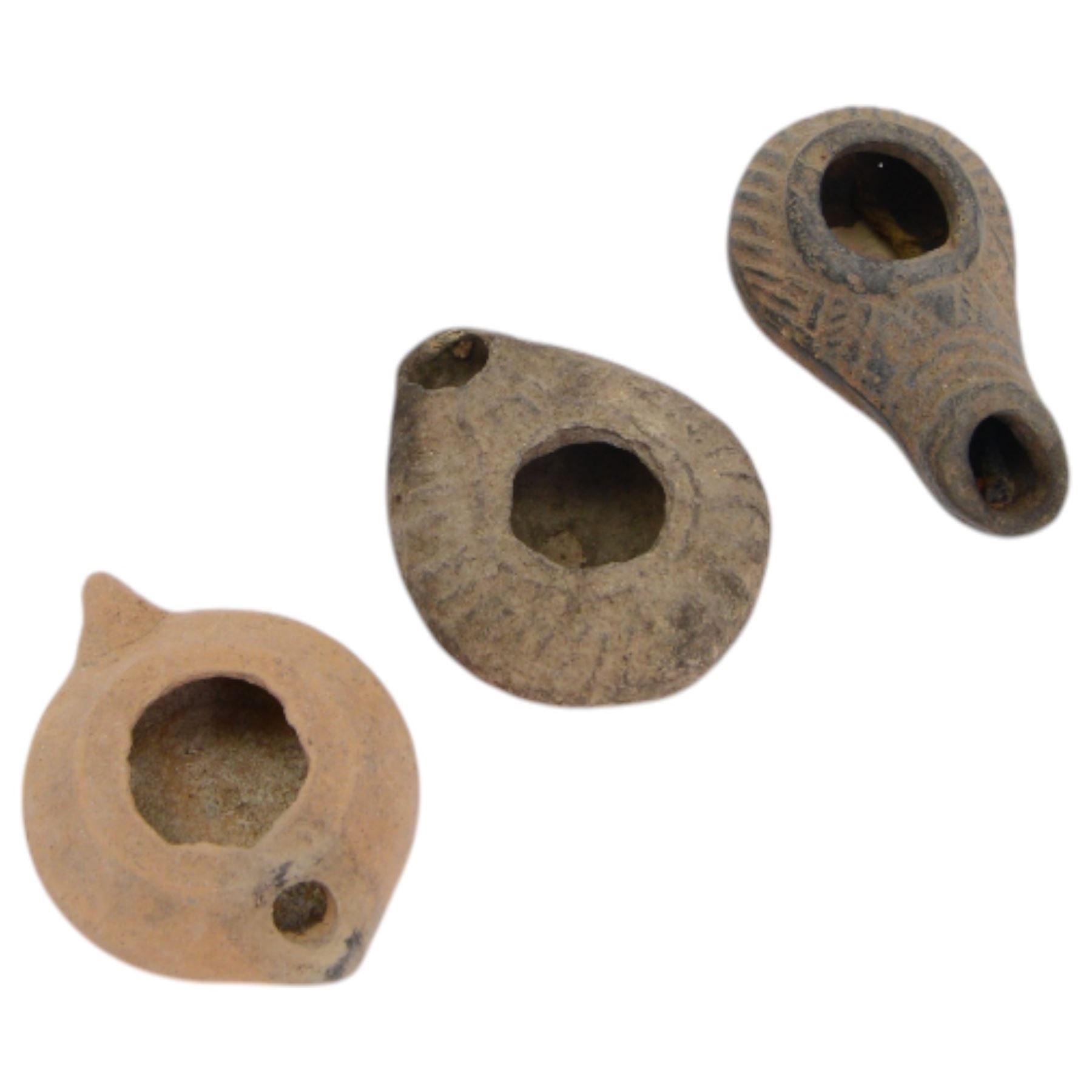 Antiquities; Persian terracotta oil lamp, 4th century BC, decorated in relief together with two later examples