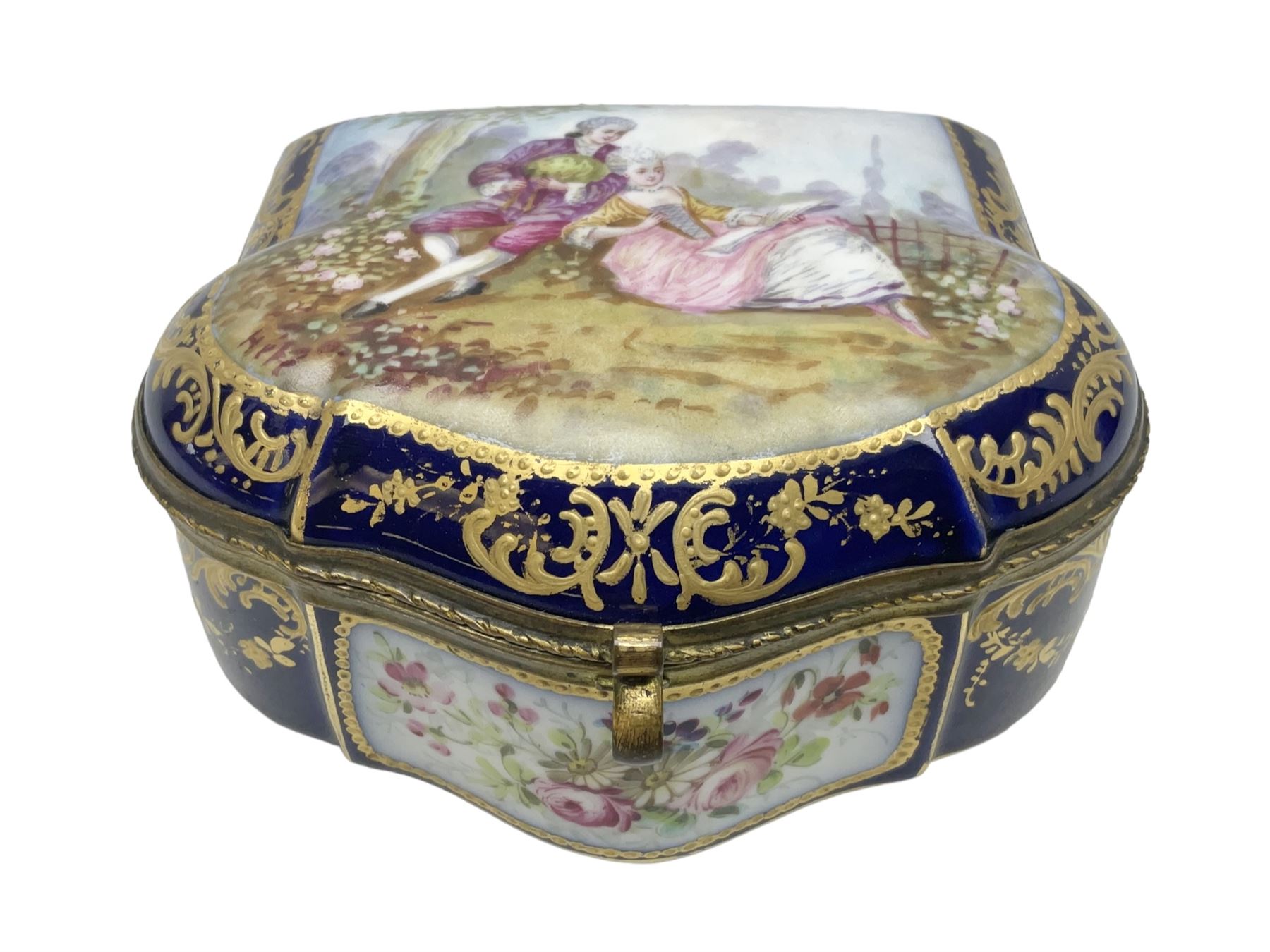 Sevres style late 19th/early 20th century trinket box decorated in the rococo style, the shaped cover painted with an 18th century courting couple in a garden scene opening to reveal the interior painted with floral sprays, the conforming body with a painted panel of floral decoration, all reserved upon cobalt blue ground with foliate gilt borders, with interlaced L's mark beneath, L12cm H6cm