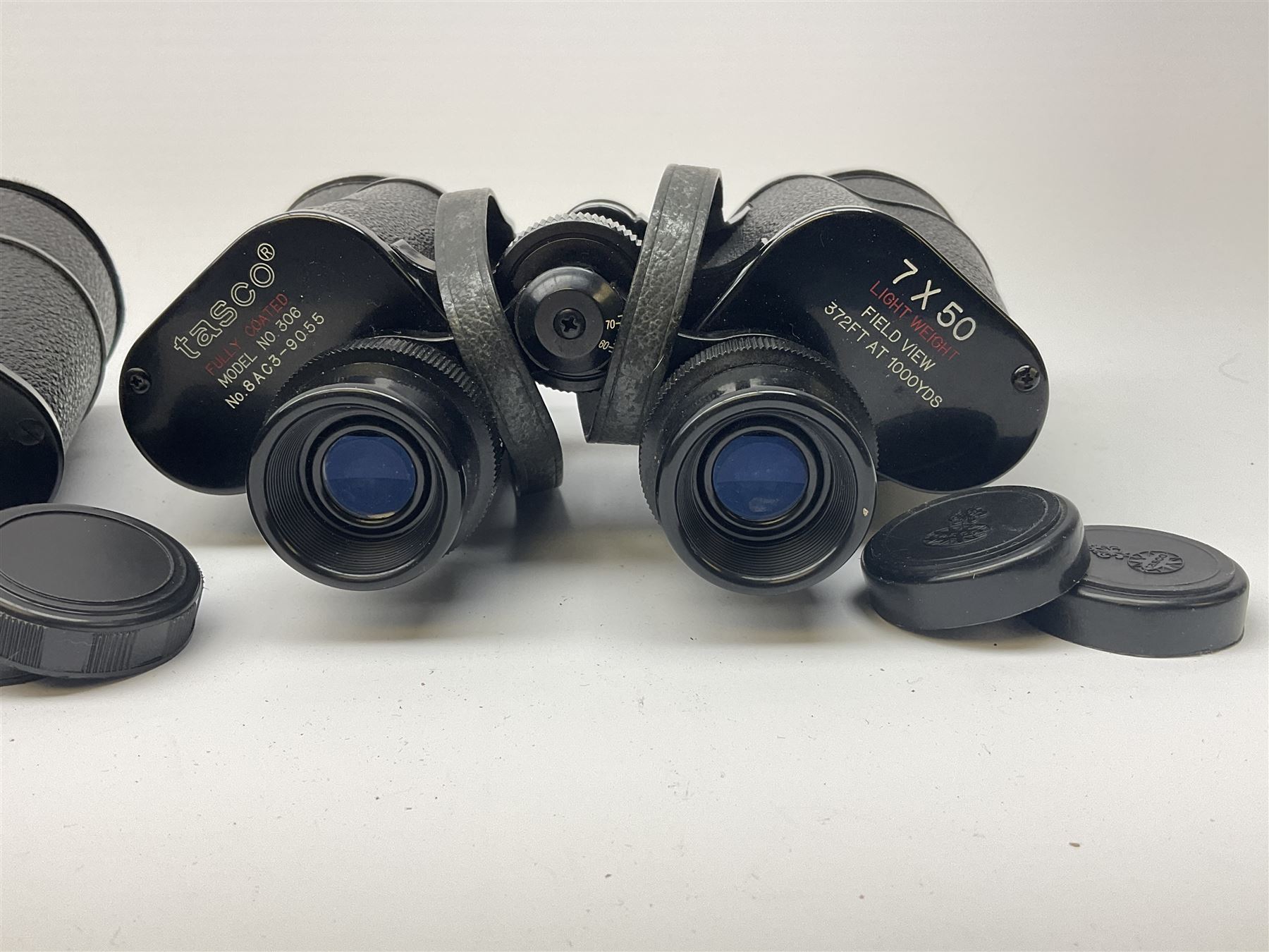 Two pairs of binoculars, Stellar binoculars in case and Tasco binoculars model 306 in case. 