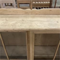 19th century pine cabinet, raised shaped back over rectangular top, enclosed by two sliding glazed doors, on turned feet - THIS LOT IS TO BE COLLECTED BY APPOINTMENT FROM THE OLD BUFFER DEPOT, MELBOURNE PLACE, SOWERBY, THIRSK, YO7 1QY