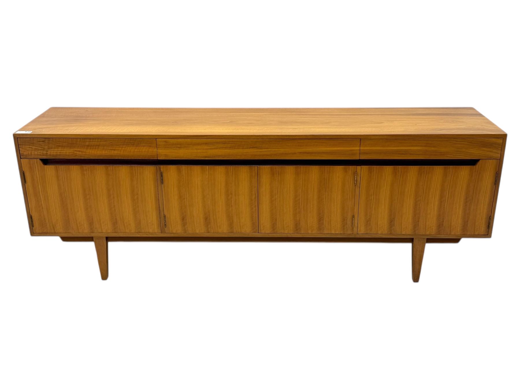 Younger - 1960s teak sideboard, three drawers over three cupboard, centre draw lined with baize with dividers, recessed handles with tapered feet