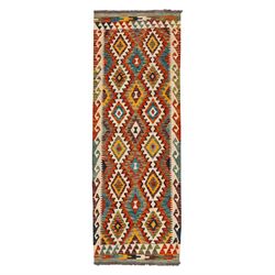 Afghan kilim ivory ground runner rug, the field with three columns of repeating lozenge mo...