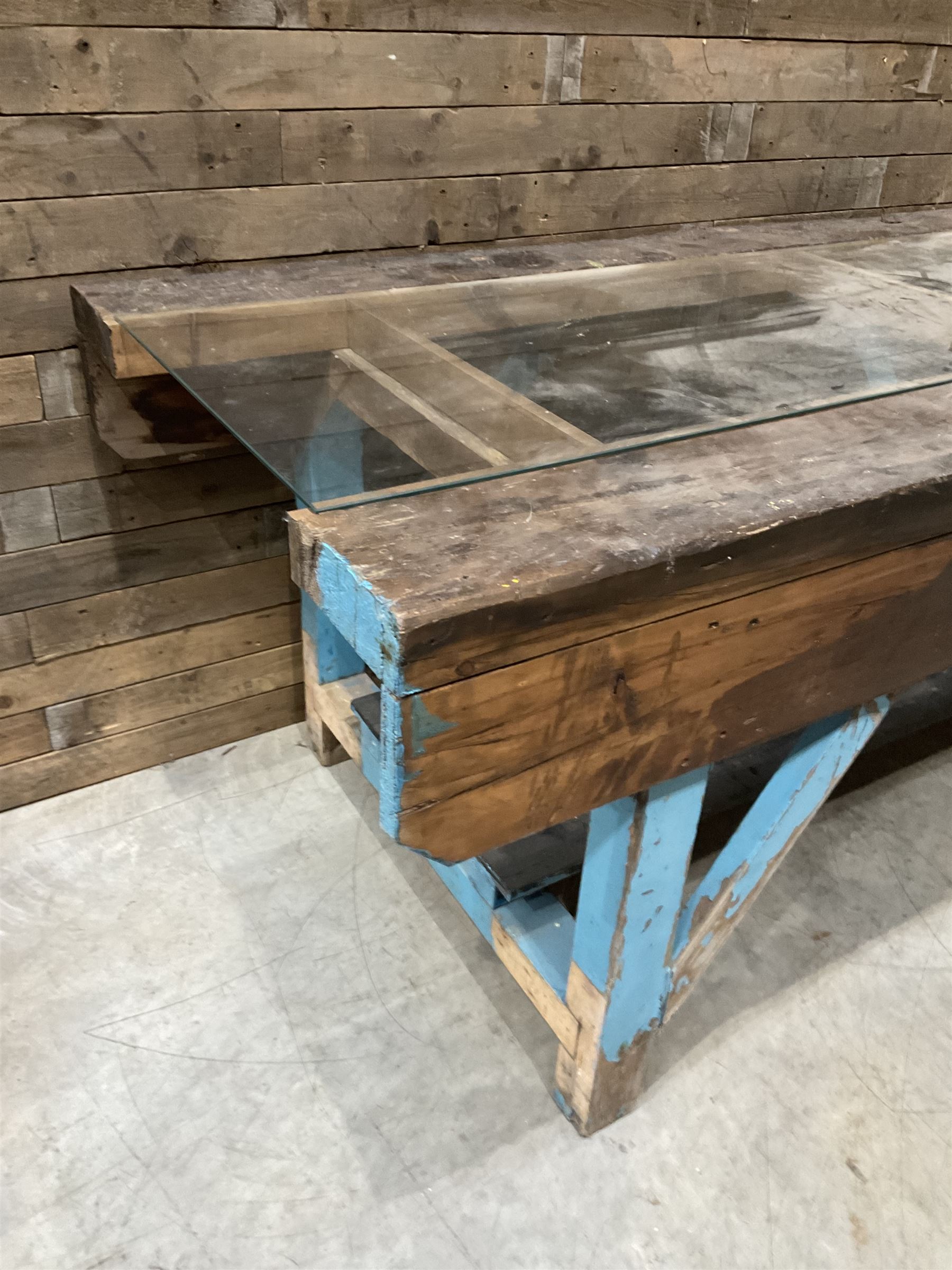 Large timber work bench with central glass section, and two pairs of vintage wooden step ladders (3)