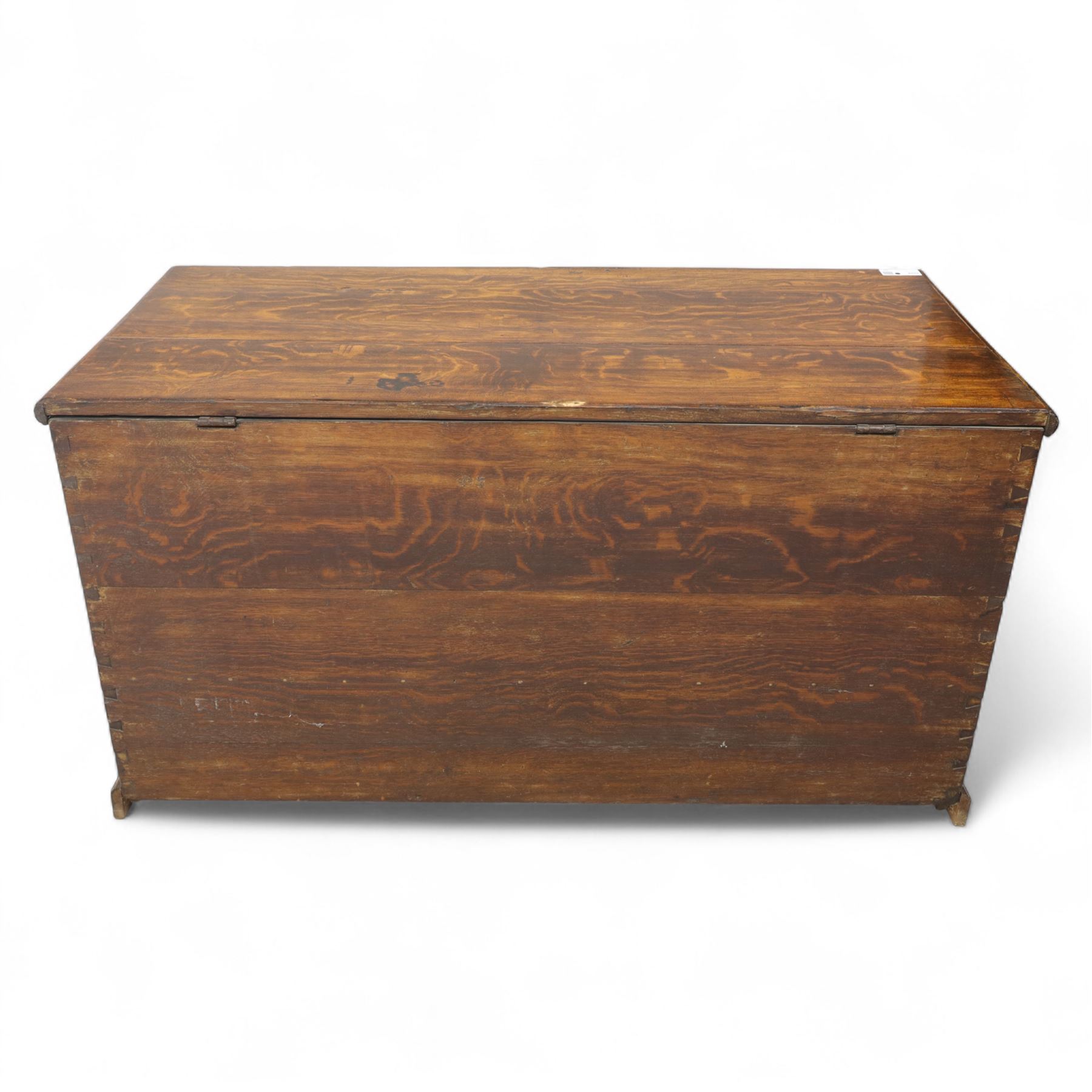 19th century oak blanket chest, rectangular hinged plank top with moulded edge, plain sides fitted with iron carrying handles, single full-width drawer to base with brass drop handles, on moulded plinth base