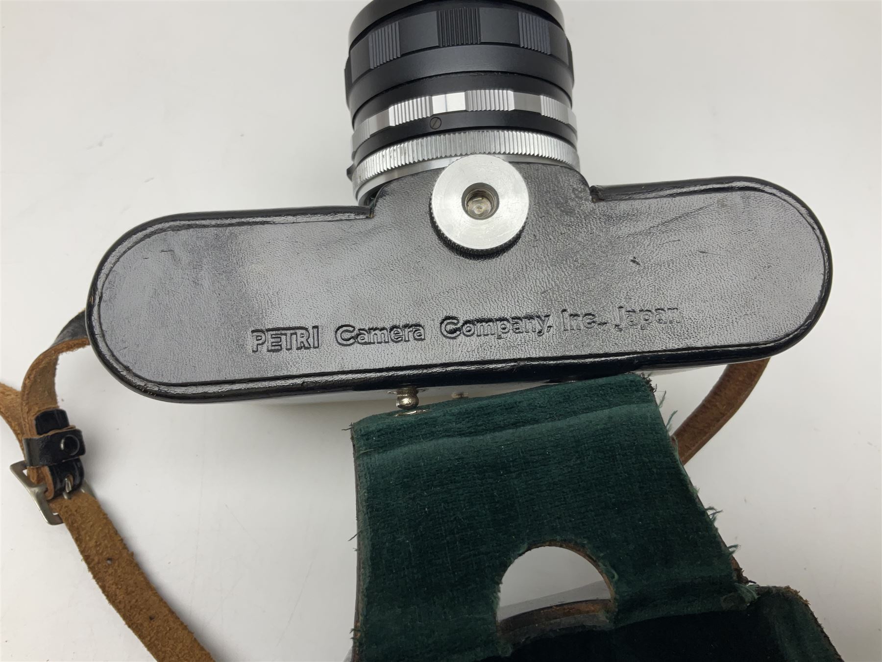 Petri Flex 7 camera body, serial no. 555698, with Perti C.C 1:1.8 f=55mm' lens, serial no. 78253, together with Petri Flex V2 camera body, serial no. 364427, with 'Petti C.C. 1:2 f=55mm' lens, serial no. 137076, in ever ready case