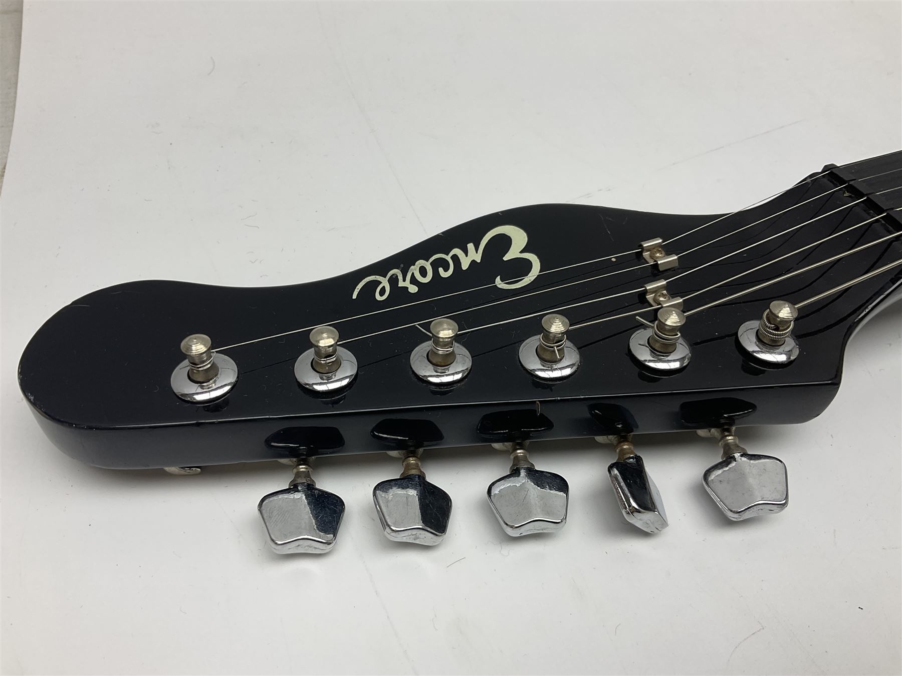 Encore black electric cut-away guitar L96cm; and Spanish Victor Garcia model 187 acoustic guitar, bears label dated 1972 L99cm; each in soft carrying case (2)