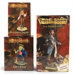 Three Pirates of the Caribbean statues, comprising a Neca limited edition Jack Sparrow Sta...