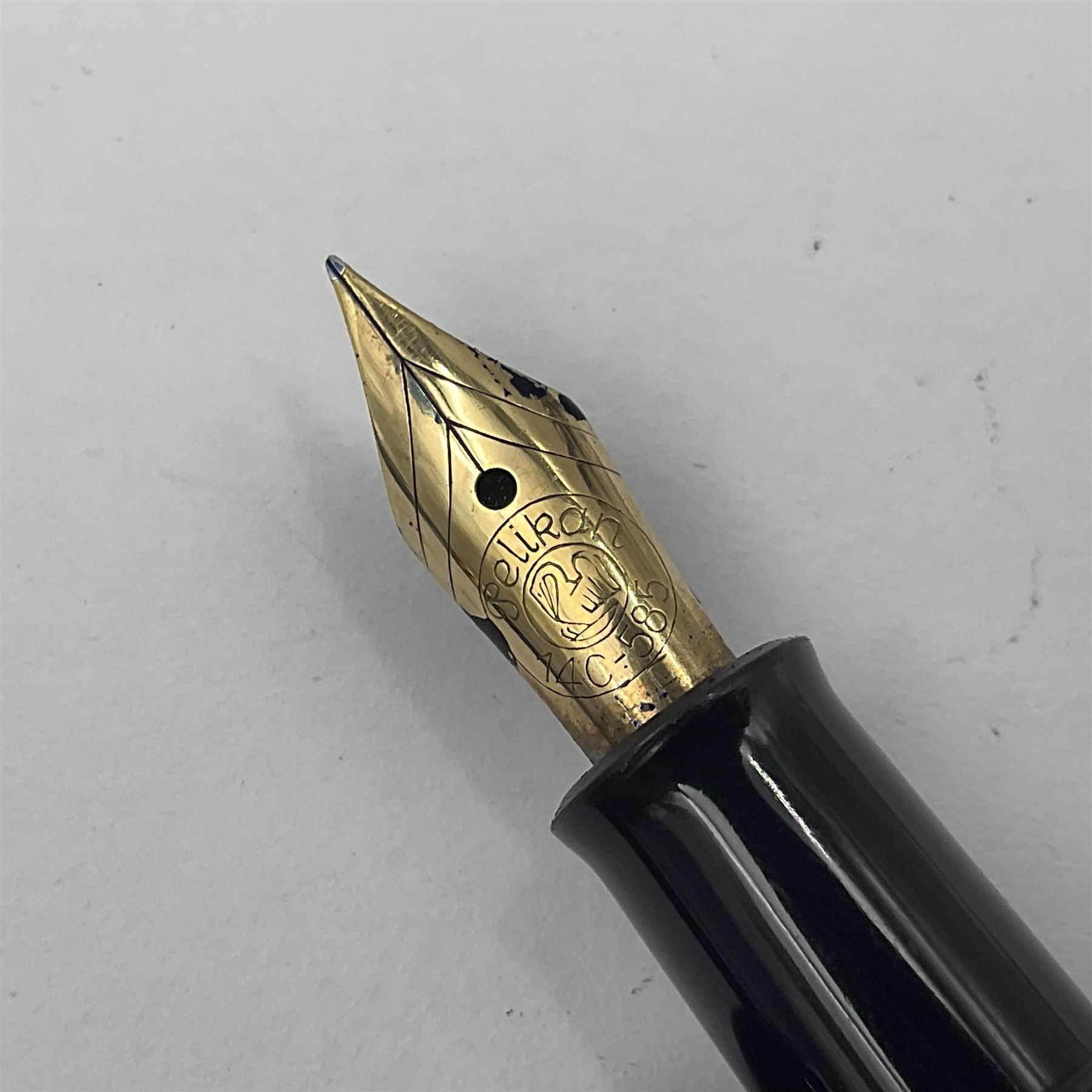 Pelikan Souveran 140 fountain pen, the green and black striped barrel with gold plated beak shaped clip and bands, with gold nib stamped 14C-585, together with matching twist ballpoint pen, push ballpoint pen and propelling pencil, largest approx L13.5cm (4)