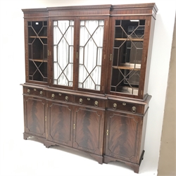 Georgian style mahogany breakfront bookcase, projecting cornice, dentil frieze, four doors above four drawers and cupboards, shaped bracket suports, W179cm, H195cm, D42cm