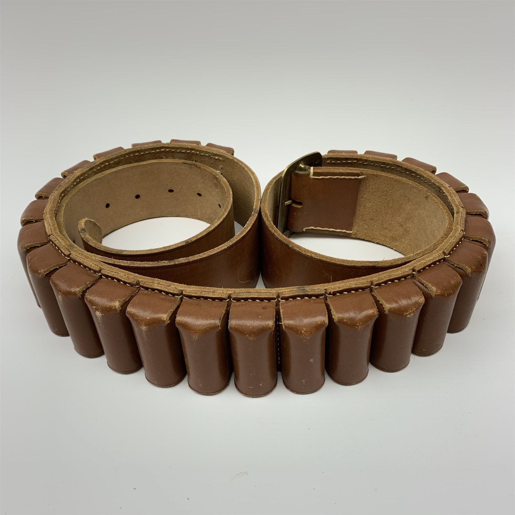 Miroku 12-bore box lock ejector over-and-under double barrel shotgun with walnut stock and 66cm barrels, No.2277306, L112cm overall; Sabel 12-bore box lock non-ejector side-by-side double barrel shotgun with 66cm barrels, No.62546, L108cm overall; Lambert Dumoulin folding .410 single barrel shotgun; and leather 12-bore cartridge belt (4) RFD ONLY