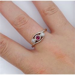 Early 20th century gold ruby and illusion set diamond crossover ring, stamped 18ct & Plat