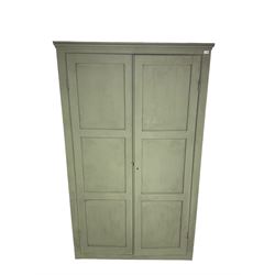 Painted pine cupboard, two panelled doors enclosing four shelves, in laurel green finish