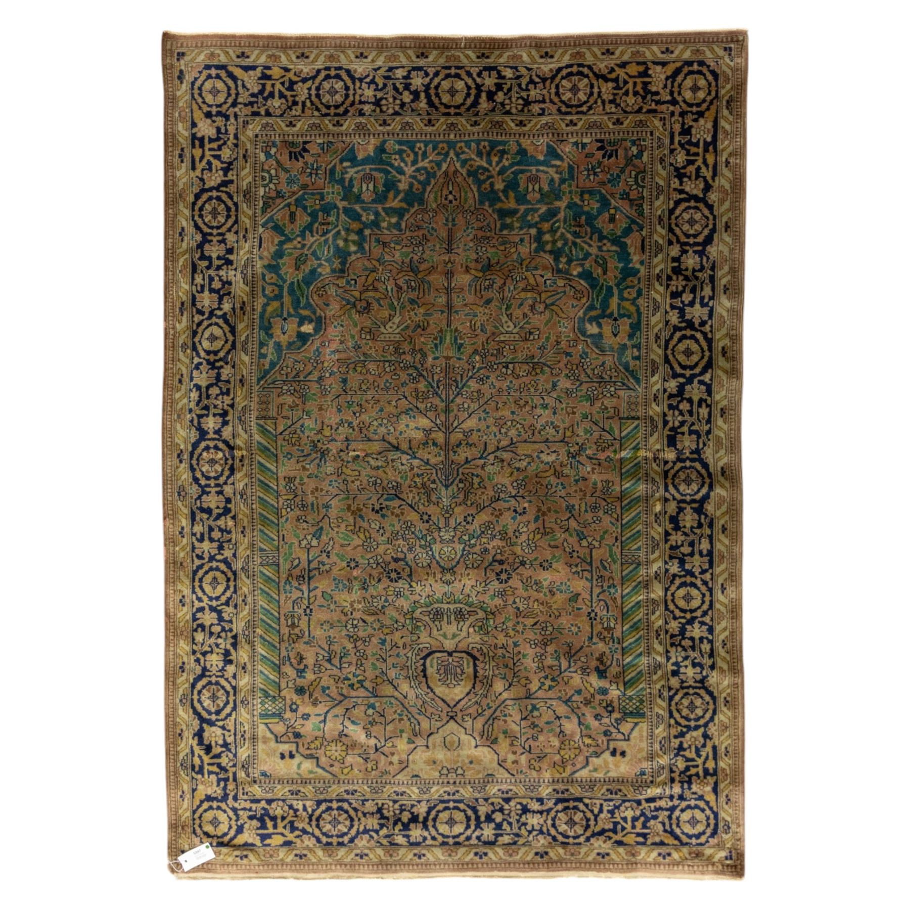 Antique Persian rug, with central tree of life design on a camel field, enclosed by dark blue floral border, with green, blue and ochre detail throughout
