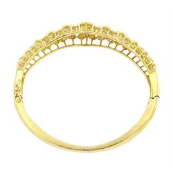 18ct gold diamond heart bangle, two rows of eleven graduating heart motifs, each set with pave set diamonds, spaced by ten round brilliant cut diamonds, total diamond weight approx 1.90 carat