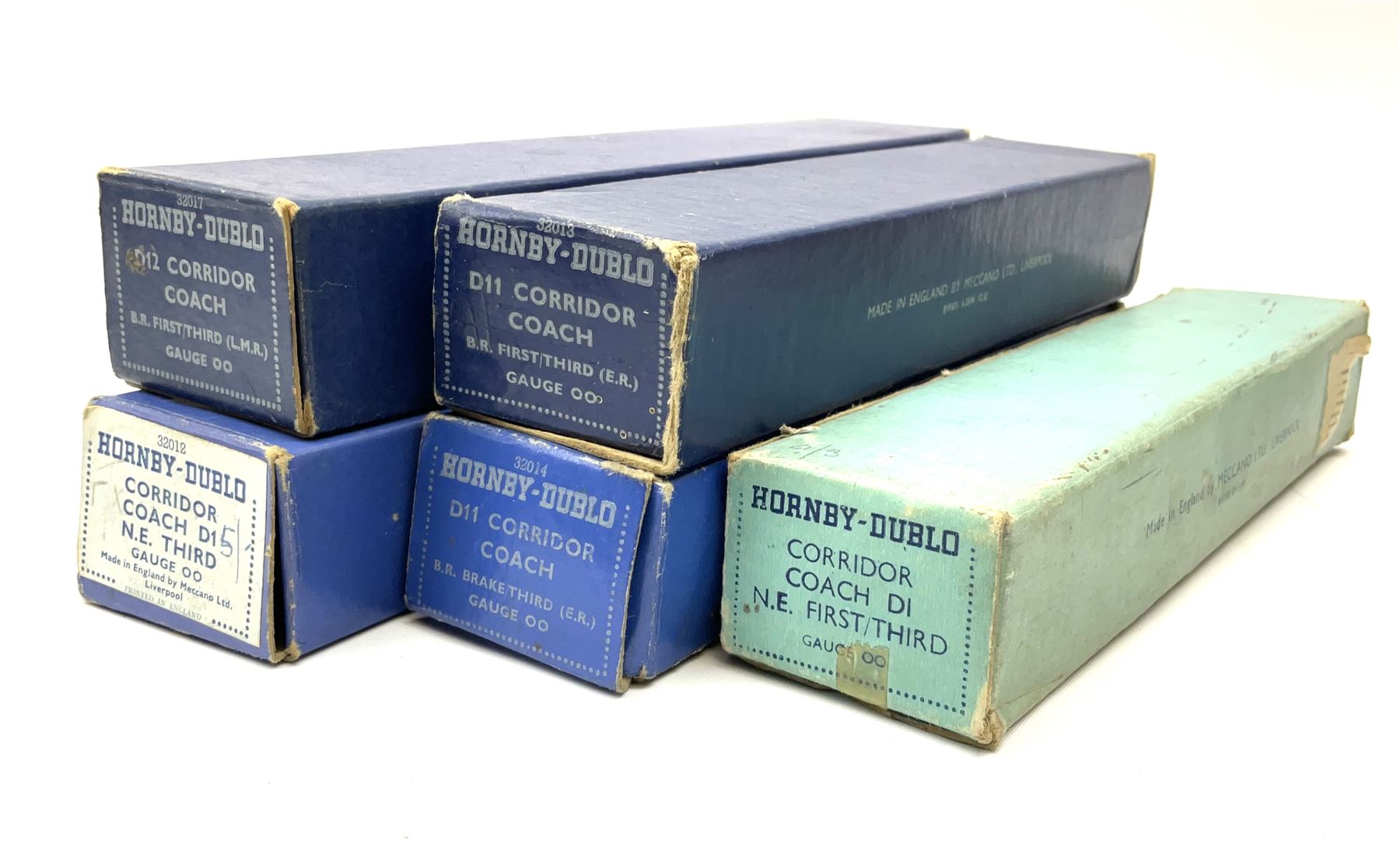 Hornby Dublo - two D1 LNER Corridor Coaches comprising First/Third, in pale blue box and Third in medium blue box; two D11 BR/ER Corridor Coaches First/Third and Brake/Third, in medium and dark blue boxes; and D12 BR/LMR First/Third Corridor Coach in dark blue box (5)