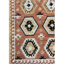 OKA - Turkish design peach ground rug, the field decorated ejder motifs within hooked and geometric design borders 