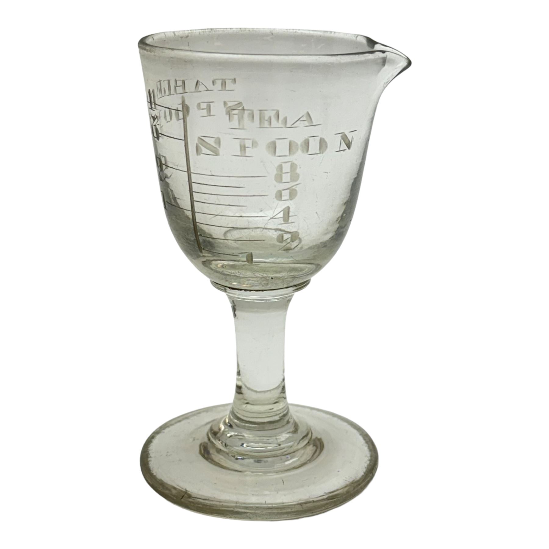 Five 19th century penny lick glasses, together with a pair of 19th century cut glass open salts with lemon squeezer bases, and a 19th century glass measure, largest example H12cm