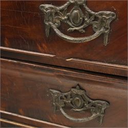 Late 19th century Continental bombe cabinet on chest, shaped moulded cornice with carved cresting, the upper section enclosed by a pair of arched glazed doors with astragal glazing revealing a shelved interior, the lower section fitted with four graduating drawers with rococo-style metal handles, serpentine front and sides, raised on scroll and paw feet