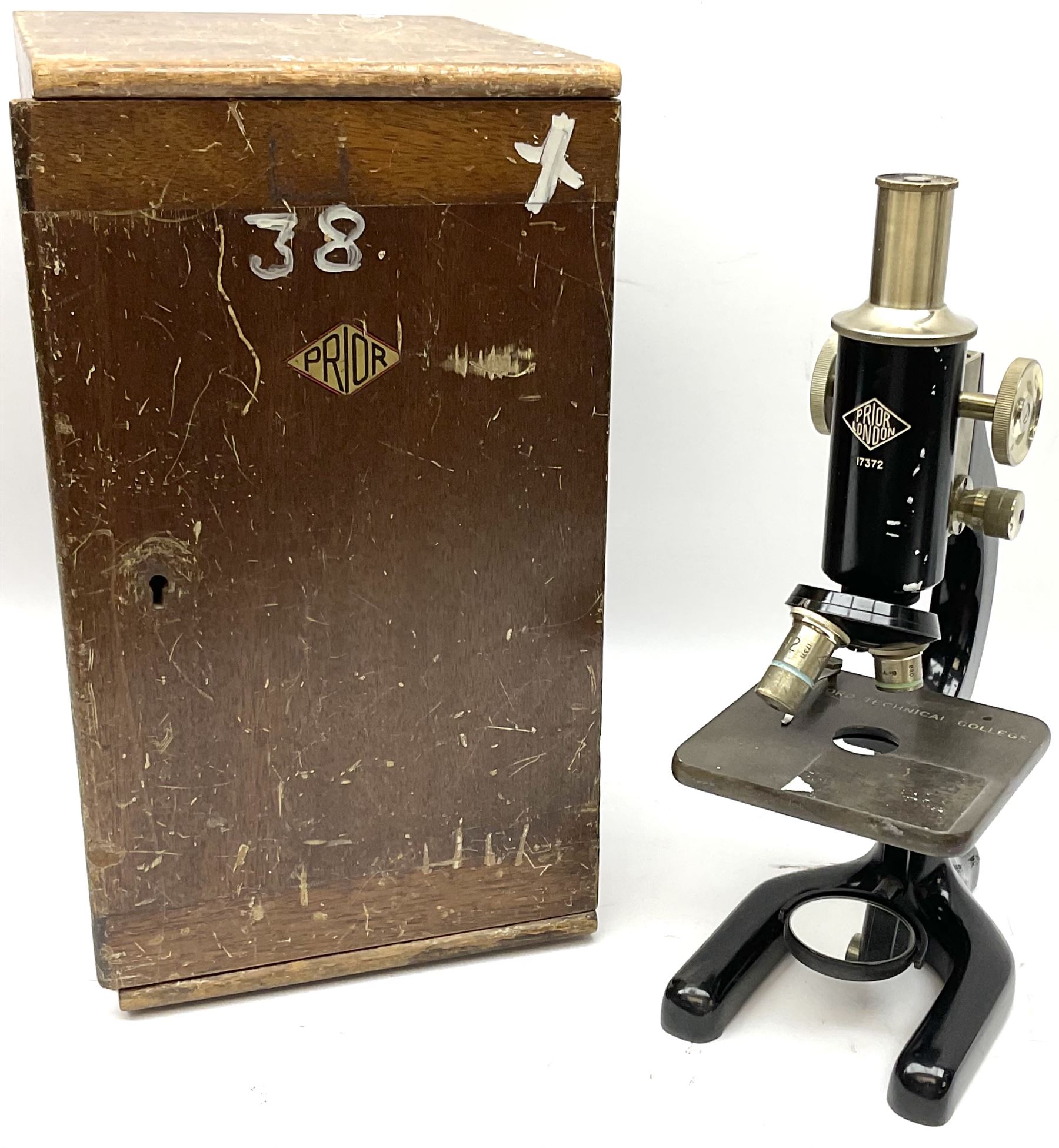 Black finished monocular microscope by Prior London No. 17372,  with pitchfork base and rack and pinion focusing, in original fitted wooden case with additional lenses, H32cm, together with Watts dumpy level, no. 116249, in a leather case