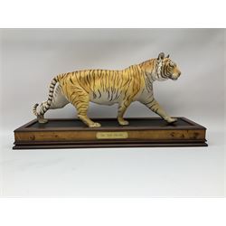 Three Franklin Mint figures, first example On The Prowl, on wooden stand H32cm, L63.5cm, Grizzly, H23cm and American Majesty by Ronald Van Ruyckevelt H37cm, together with five other figures.  