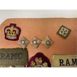 Quantity of WW1 and later RAMC and RSM cloth and metal badges and insignia
