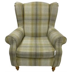 Next Home - 'Sherlock' hardwood framed wingback armchair, upholstered in pale green checkered fabric, on turned front feet