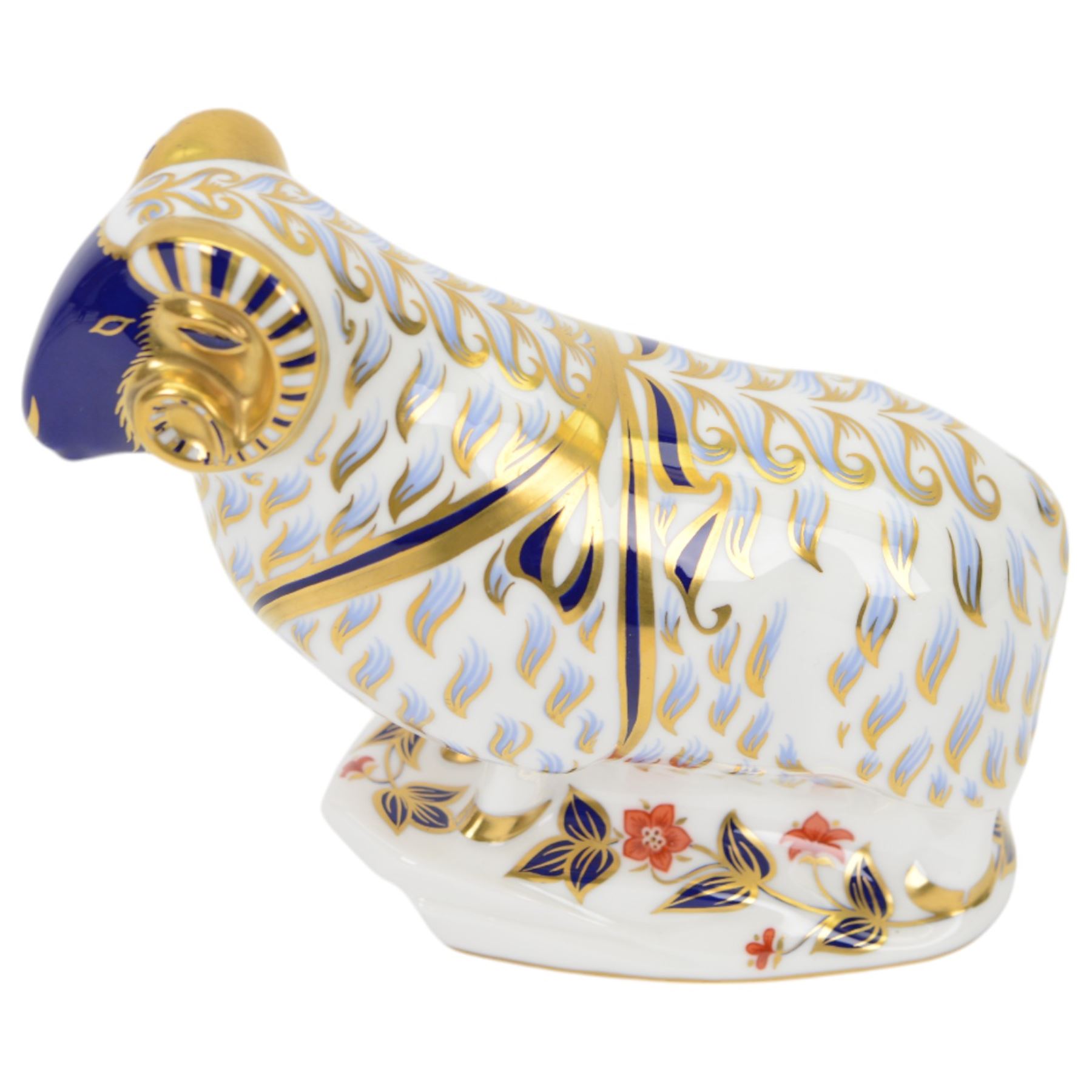 Four Royal Crown Derby paperweights, comprising Large Ram with gold stopper, Penguin with gold stopper, The Spaniel with gold stopper and box and Contented Cat with gold stopper and box   