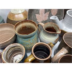 Wold studio pottery tankards, in various colours and relief decoration together with other studio items including vases, jugs and pots 